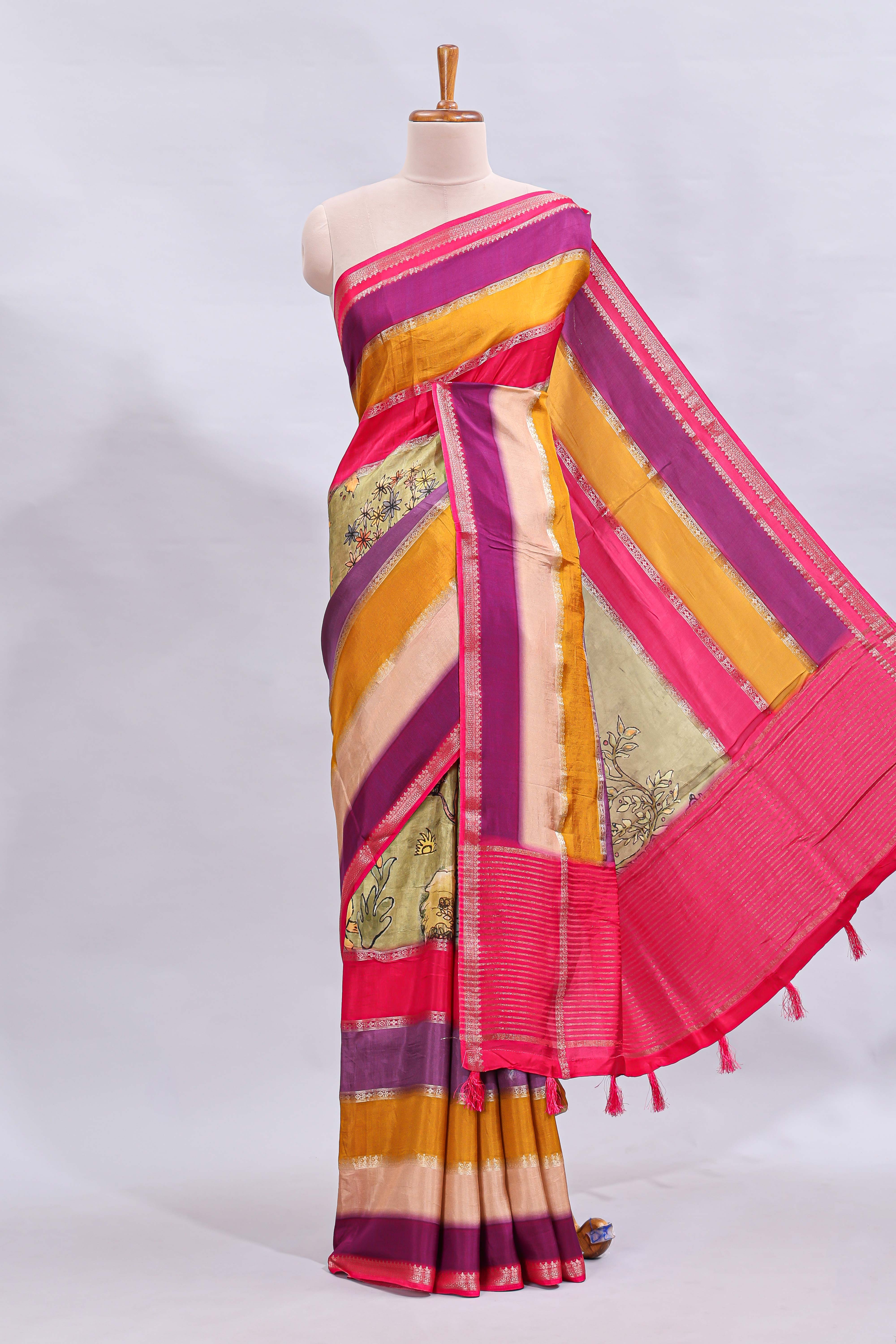 Multi color kalamkari style printed saree with contrast zari border and motifs blouse
