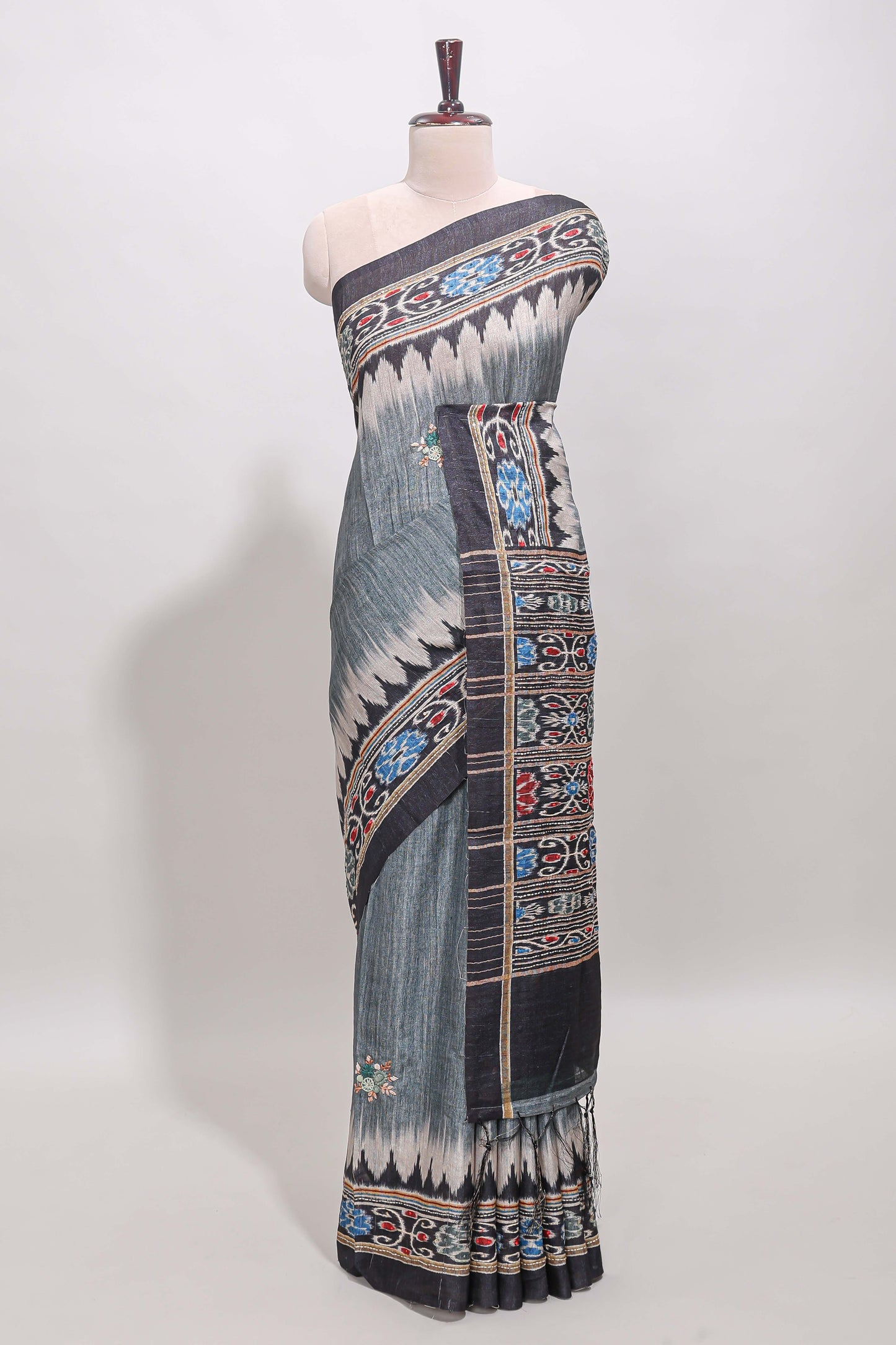 Grey ikkat style floral motifs tussar saree with contrast border and crane bird motif blouse
