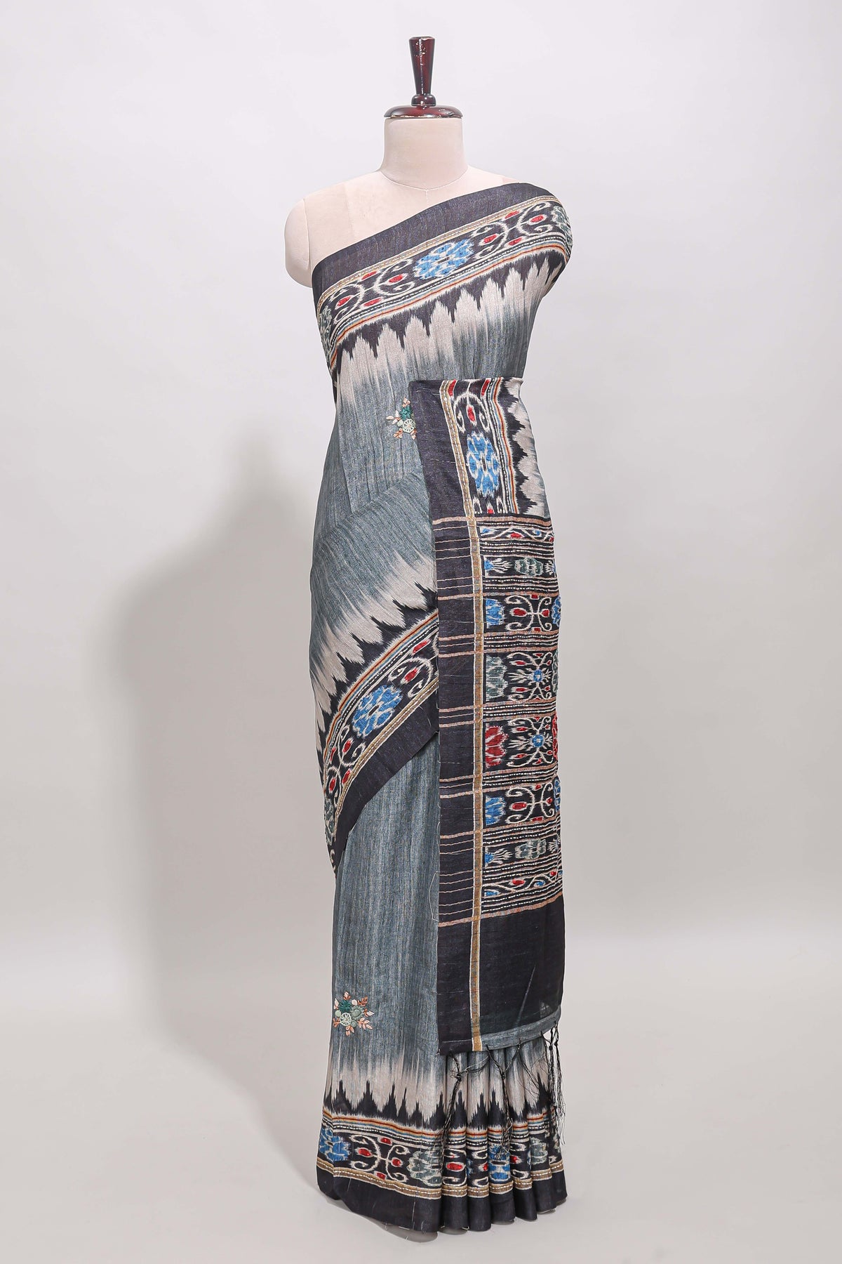 Grey ikkat style floral motifs tussar saree with contrast border and crane bird motif blouse