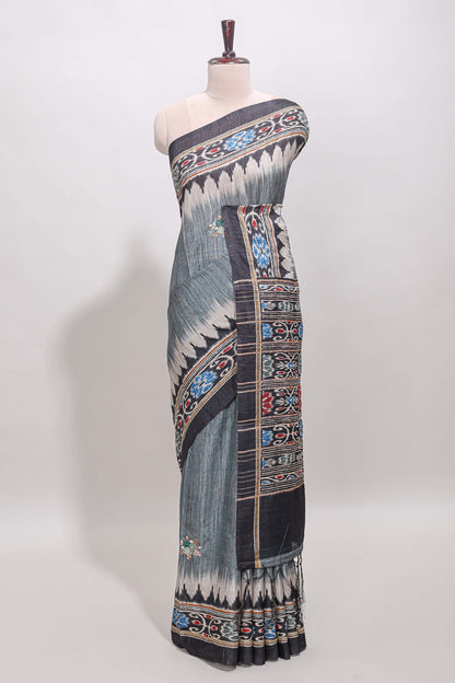 Grey ikkat style floral motifs tussar saree with contrast border and crane bird motif blouse