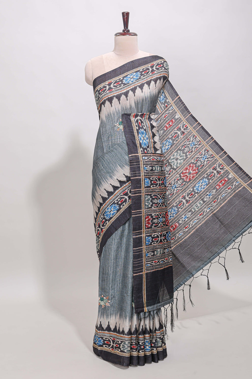 Grey ikkat style floral motifs tussar saree with contrast border and crane bird motif blouse