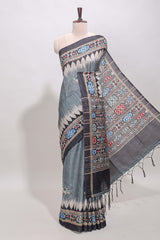 Grey ikkat style floral motifs tussar saree with contrast border and crane bird motif blouse