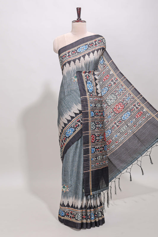 Grey ikkat style floral motifs tussar saree with contrast border and crane bird motif blouse