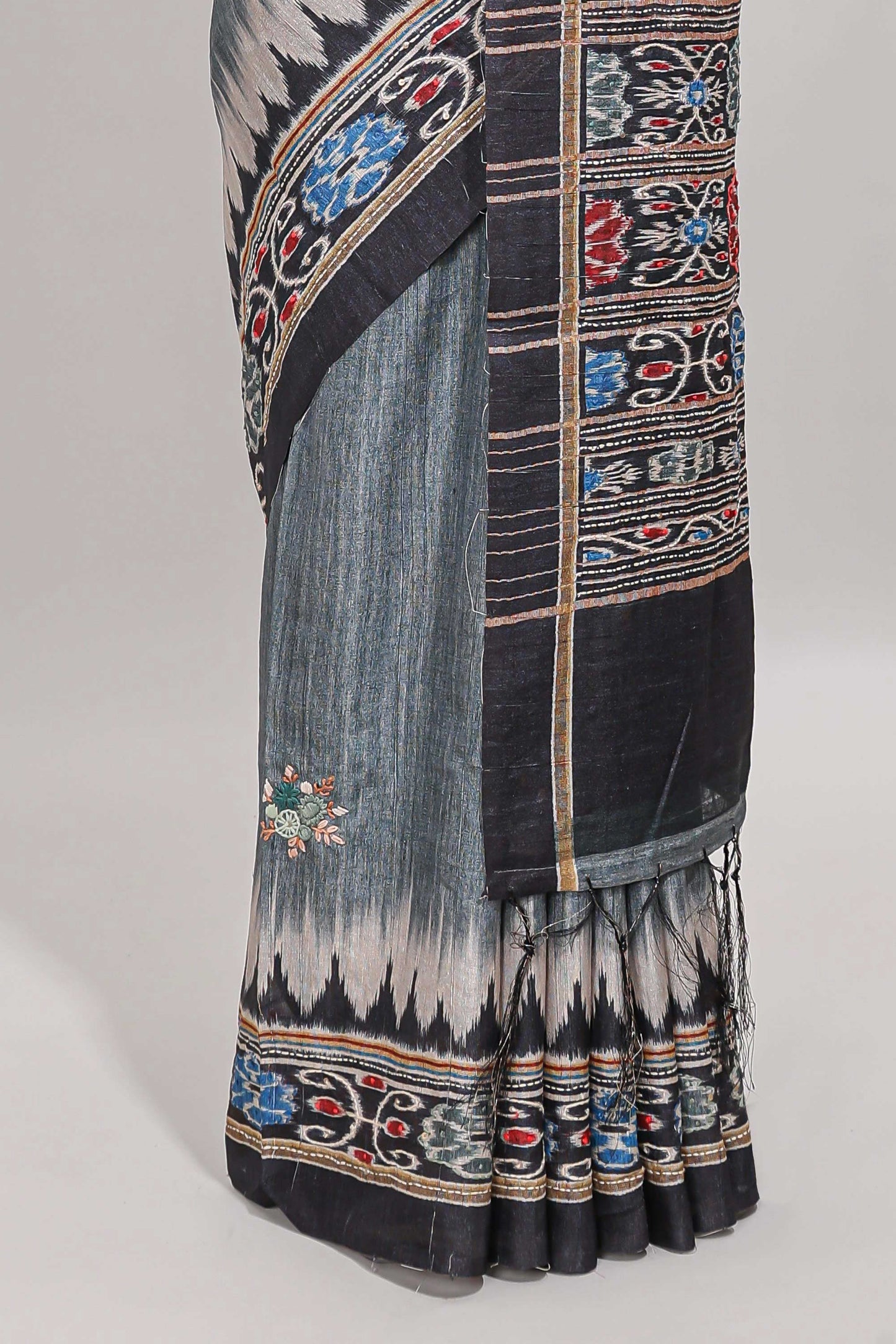 Grey ikkat style floral motifs tussar saree with contrast border and crane bird motif blouse