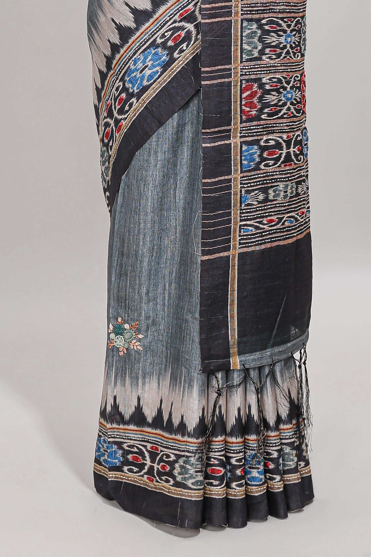 Grey ikkat style floral motifs tussar saree with contrast border and crane bird motif blouse