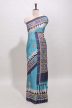 Blue ikkat style floral motifs tussar saree with contrast border and crane bird motif blouse