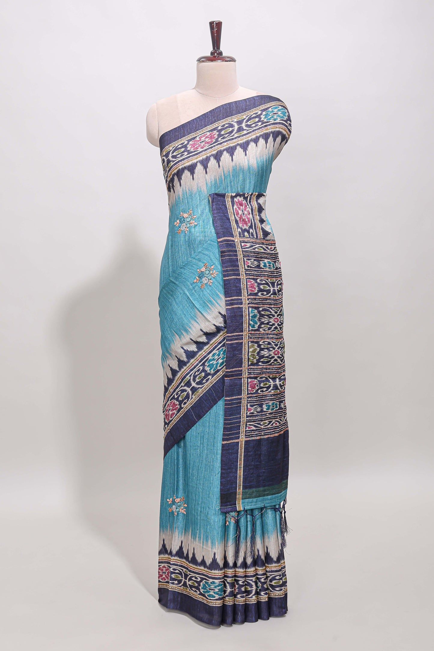 Blue ikkat style floral motifs tussar saree with contrast border and crane bird motif blouse