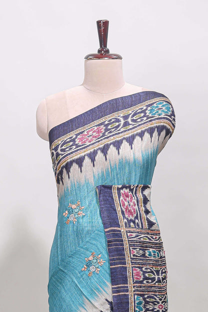 Blue ikkat style floral motifs tussar saree with contrast border and crane bird motif blouse