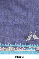 Blue ikkat style floral motifs tussar saree with contrast border and crane bird motif blouse