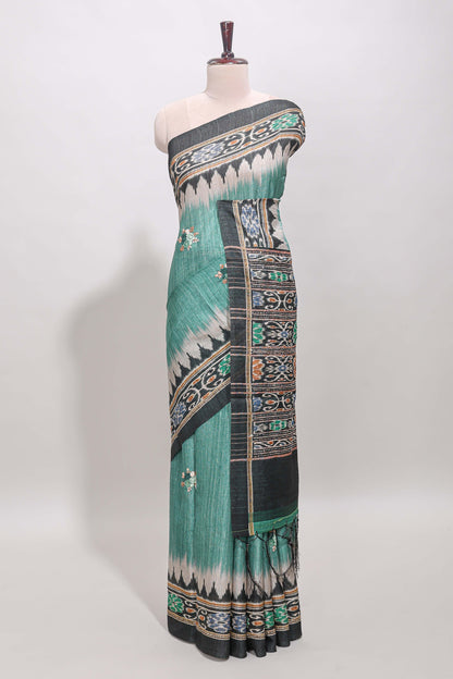 Green ikkat style floral motifs tussar saree with contrast border and crane bird motif blouse