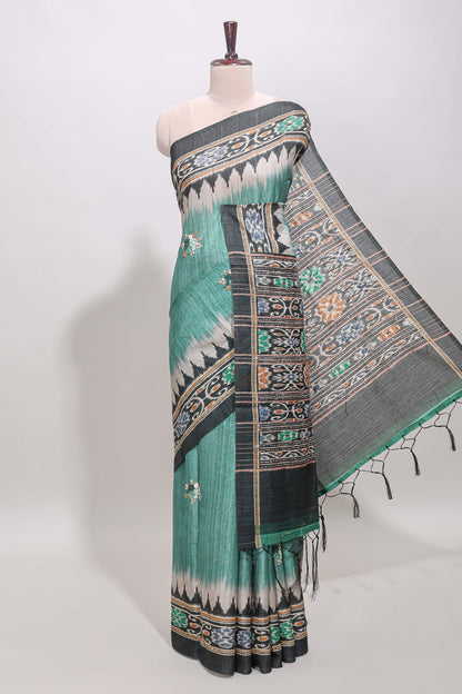 Green ikkat style floral motifs tussar saree with contrast border and crane bird motif blouse