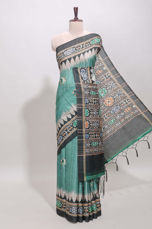 Green ikkat style floral motifs tussar saree with contrast border and crane bird motif blouse