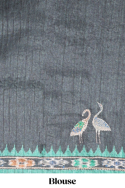 Green ikkat style floral motifs tussar saree with contrast border and crane bird motif blouse