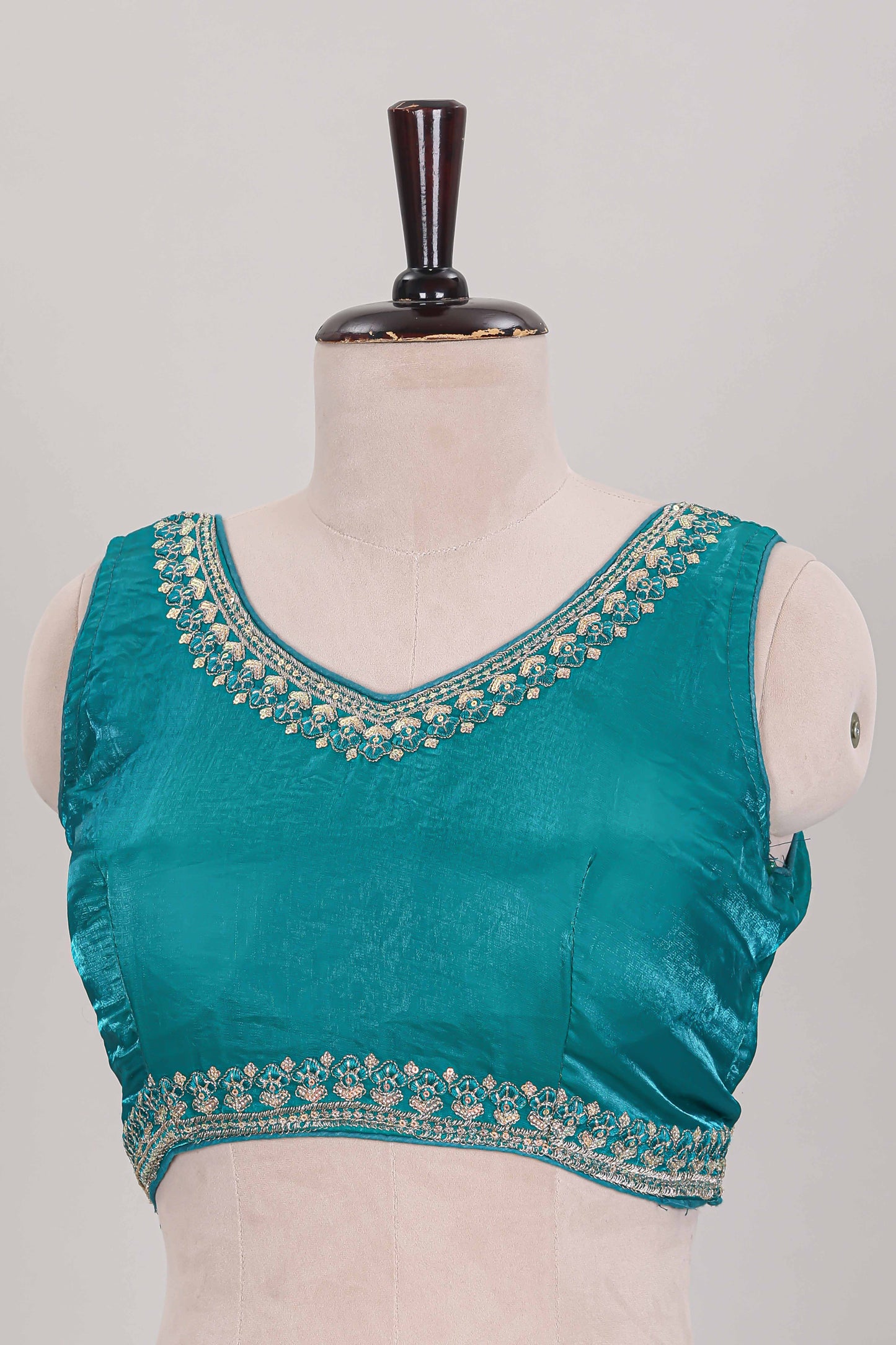 Turquoise green embroidery work readymade designer blouse, sleeveless sweatheart neck with back tassels