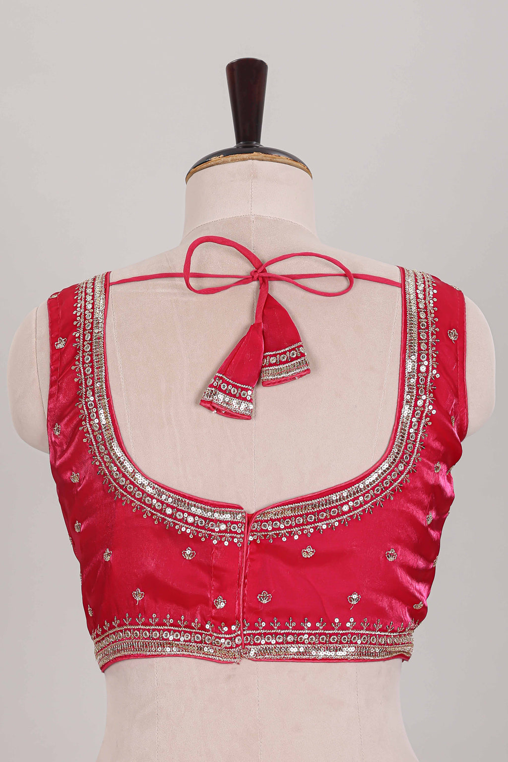 Rani pink embroidery work readymade designer blouse, sleeveless V neck with back tassels