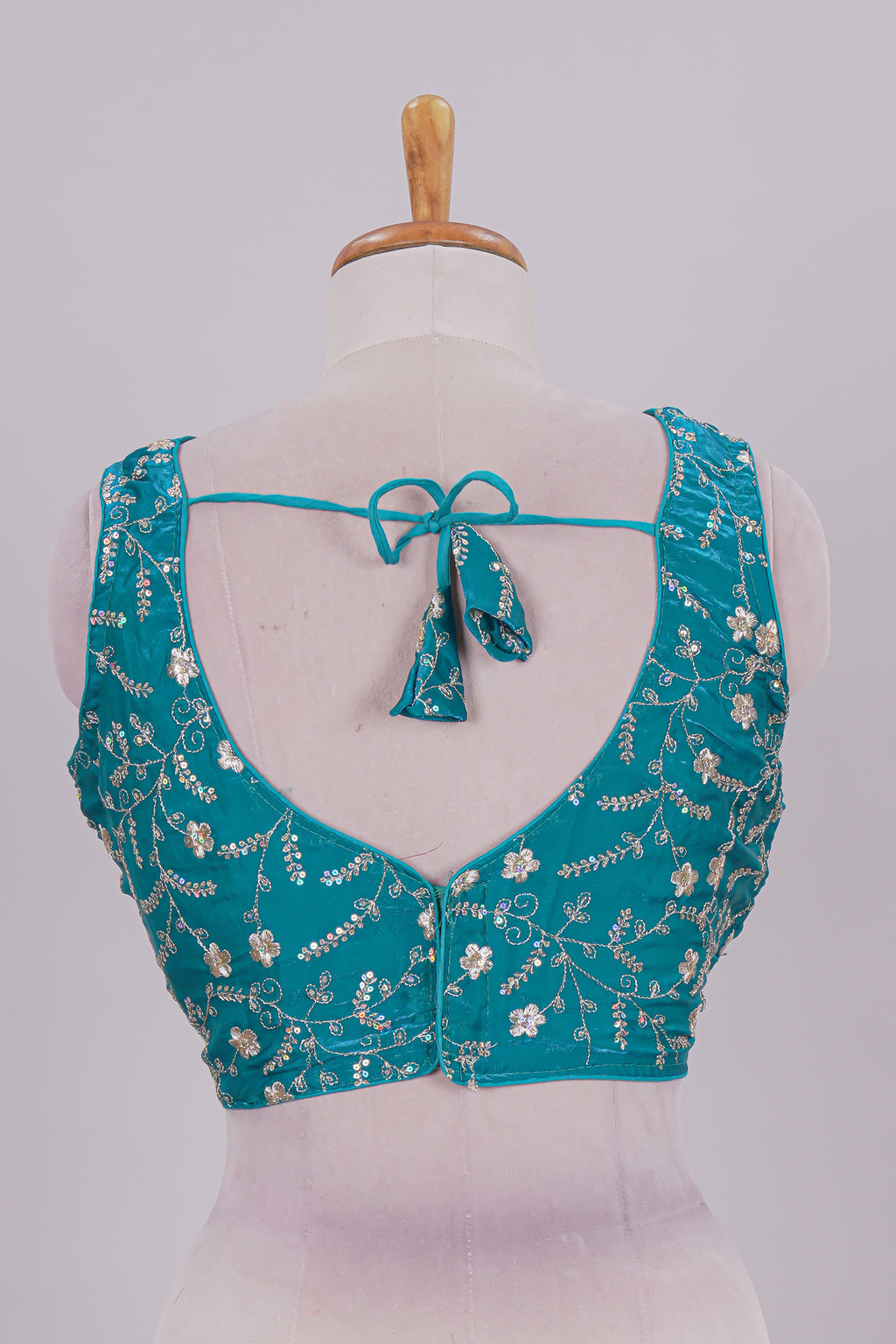 Viridian green floral chamki embroidery work readymade designer blouse, sleeveless V neck with back tassels
