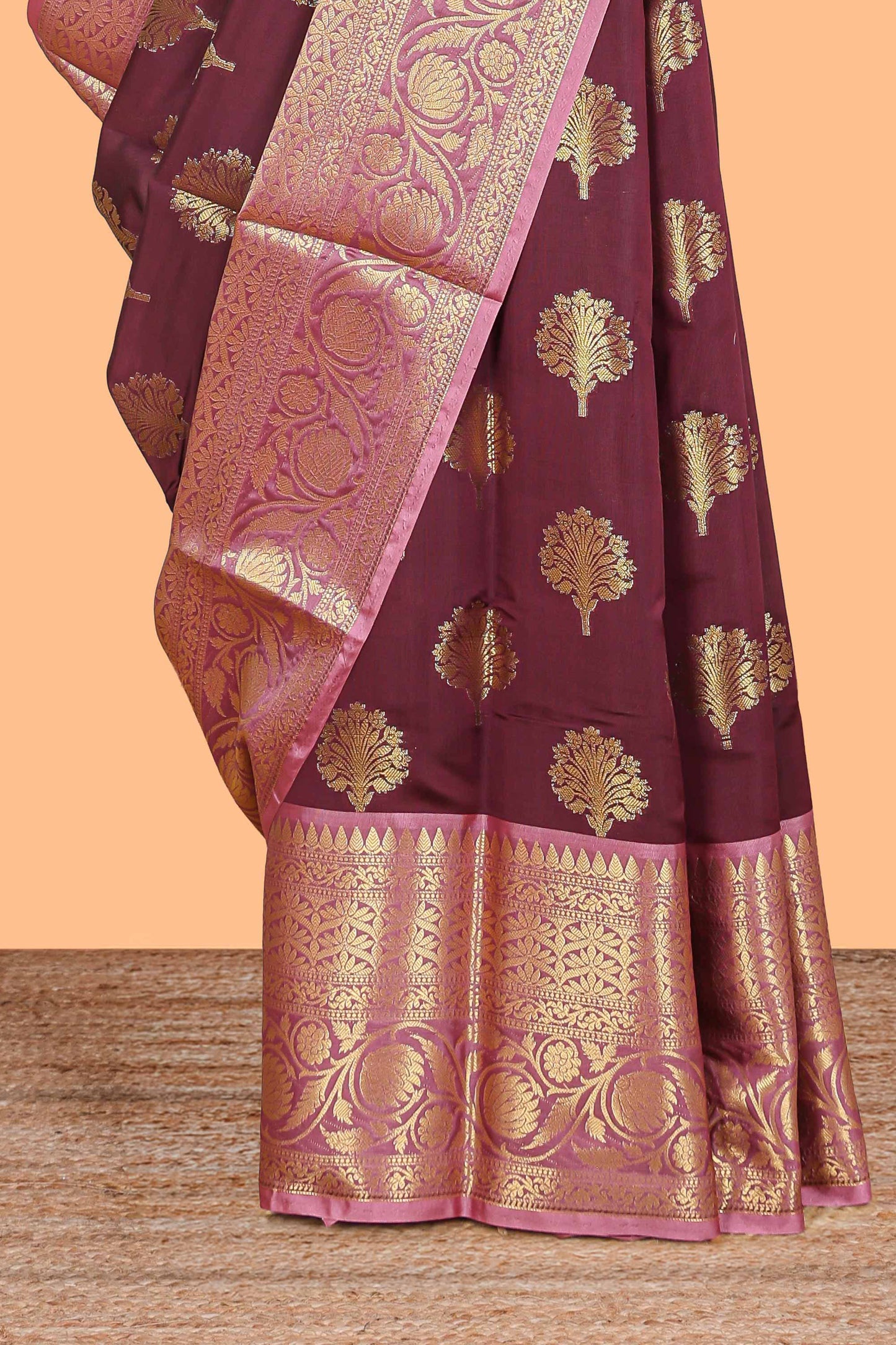 Maroon floral design zari butta raw silk saree with contrast zari border and pallu