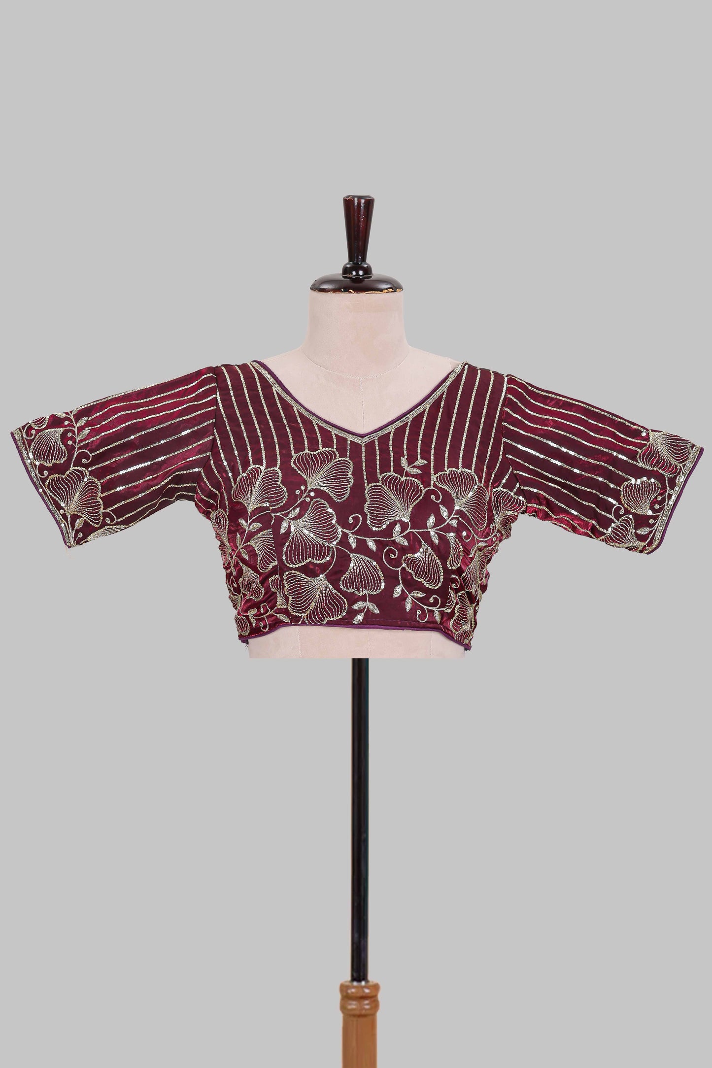 Maroon floral butta design embroidery work readymade designer blouse, sleeveless V neck with back tassels