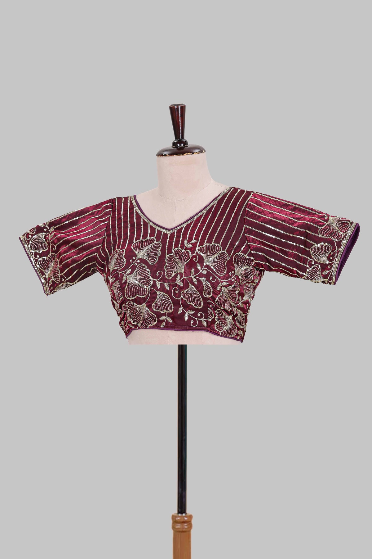 Maroon floral butta design embroidery work readymade designer blouse, sleeveless V neck with back tassels