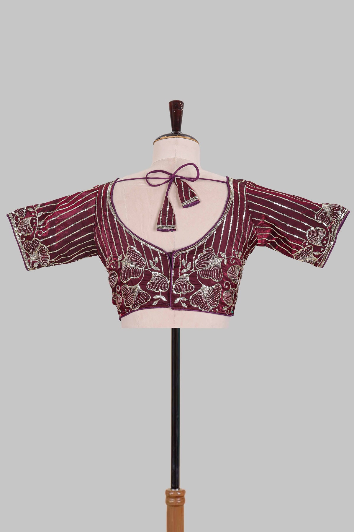 Maroon floral butta design embroidery work readymade designer blouse, sleeveless V neck with back tassels