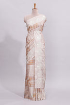 Beige striped design raw silk saree with self border and matching blouse