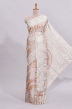 Beige striped design raw silk saree with self border and matching blouse