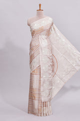 Beige striped design raw silk saree with self border and matching blouse