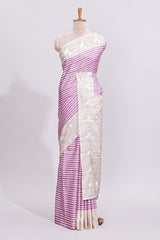 Beige striped design raw silk saree with self border and matching blouse