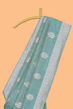 Green floral zari design raw silk saree with self zari border and matching motifs blouse