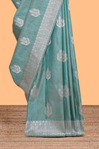 Green floral zari design raw silk saree with self zari border and matching motifs blouse