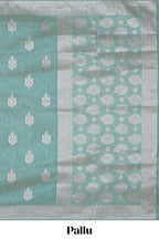 Green floral zari design raw silk saree with self zari border and matching motifs blouse