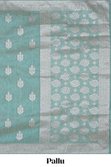 Green floral zari design raw silk saree with self zari border and matching motifs blouse