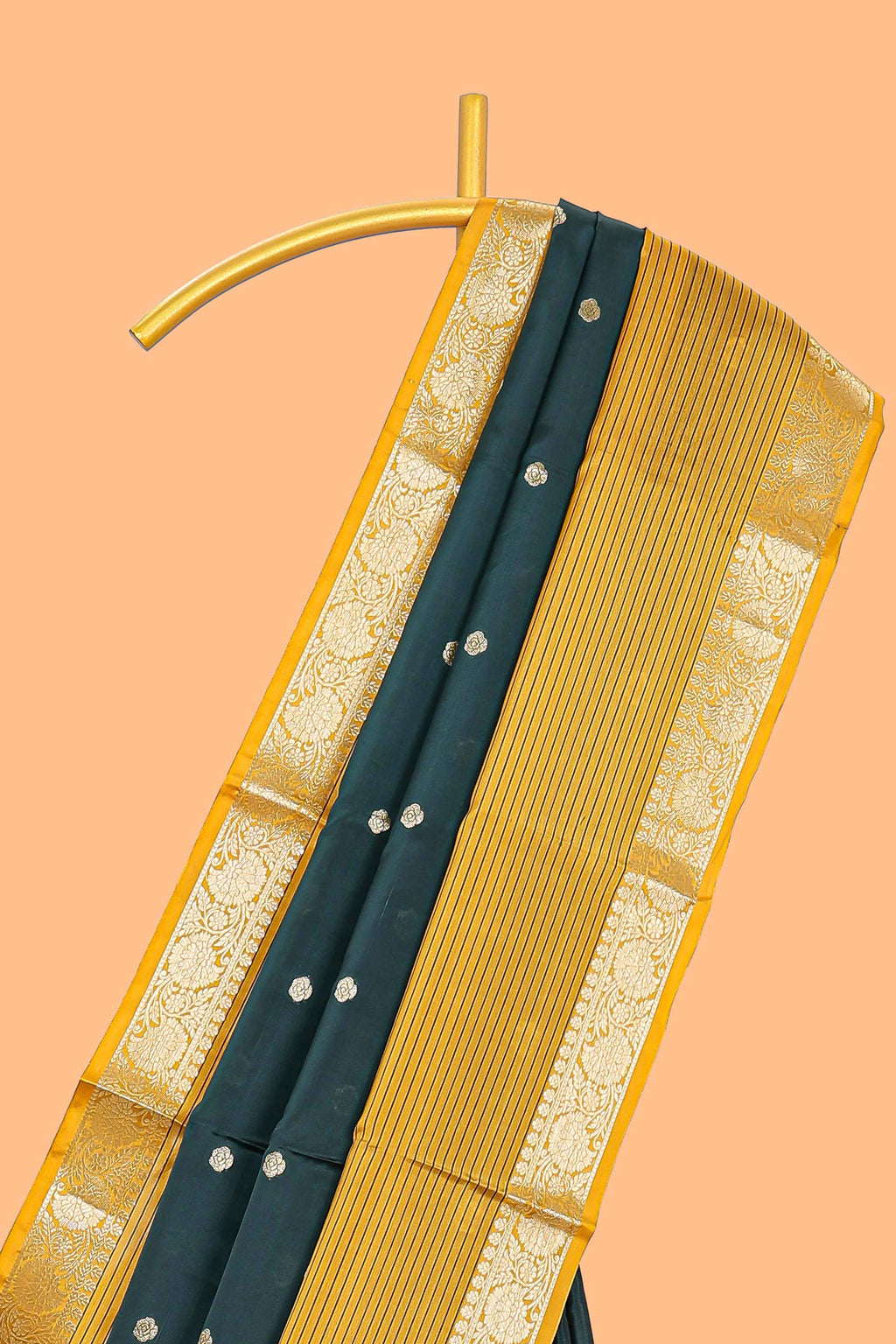 Green butta designed raw silk saree with contrast border and blouse