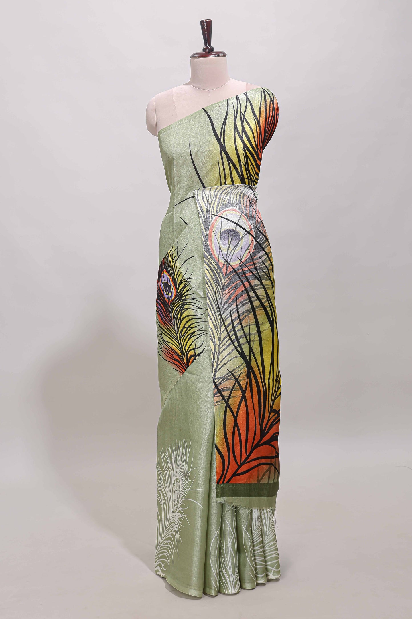 Pastel green peacock feather print south cotton saree with matching blouse