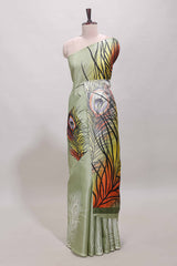 Pastel green peacock feather print south cotton saree with matching blouse