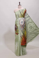 Pastel green peacock feather print south cotton saree with matching blouse