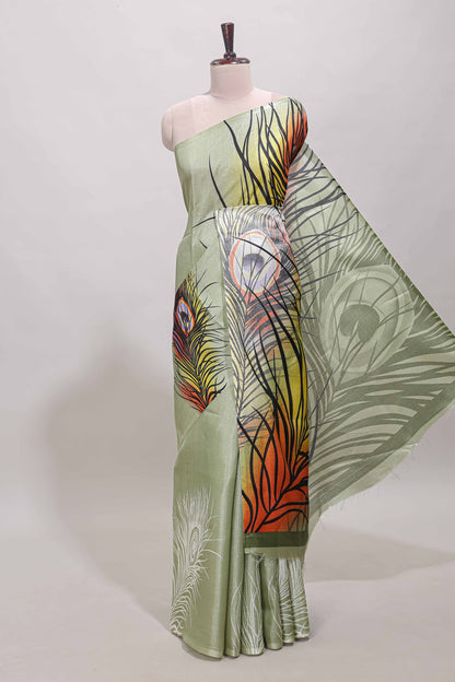 Pastel green peacock feather print south cotton saree with matching blouse