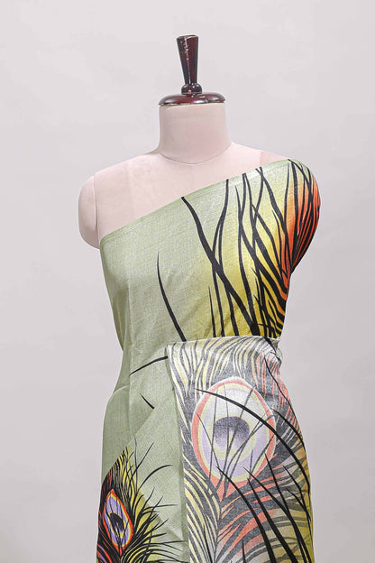 Pastel green peacock feather print south cotton saree with matching blouse
