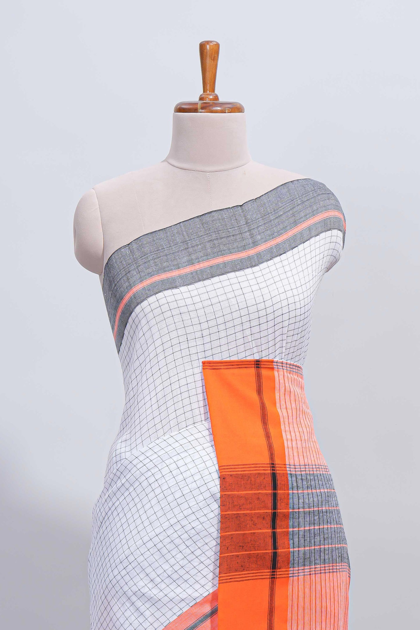 White checked south cotton saree with contrast border and matching striped pallu