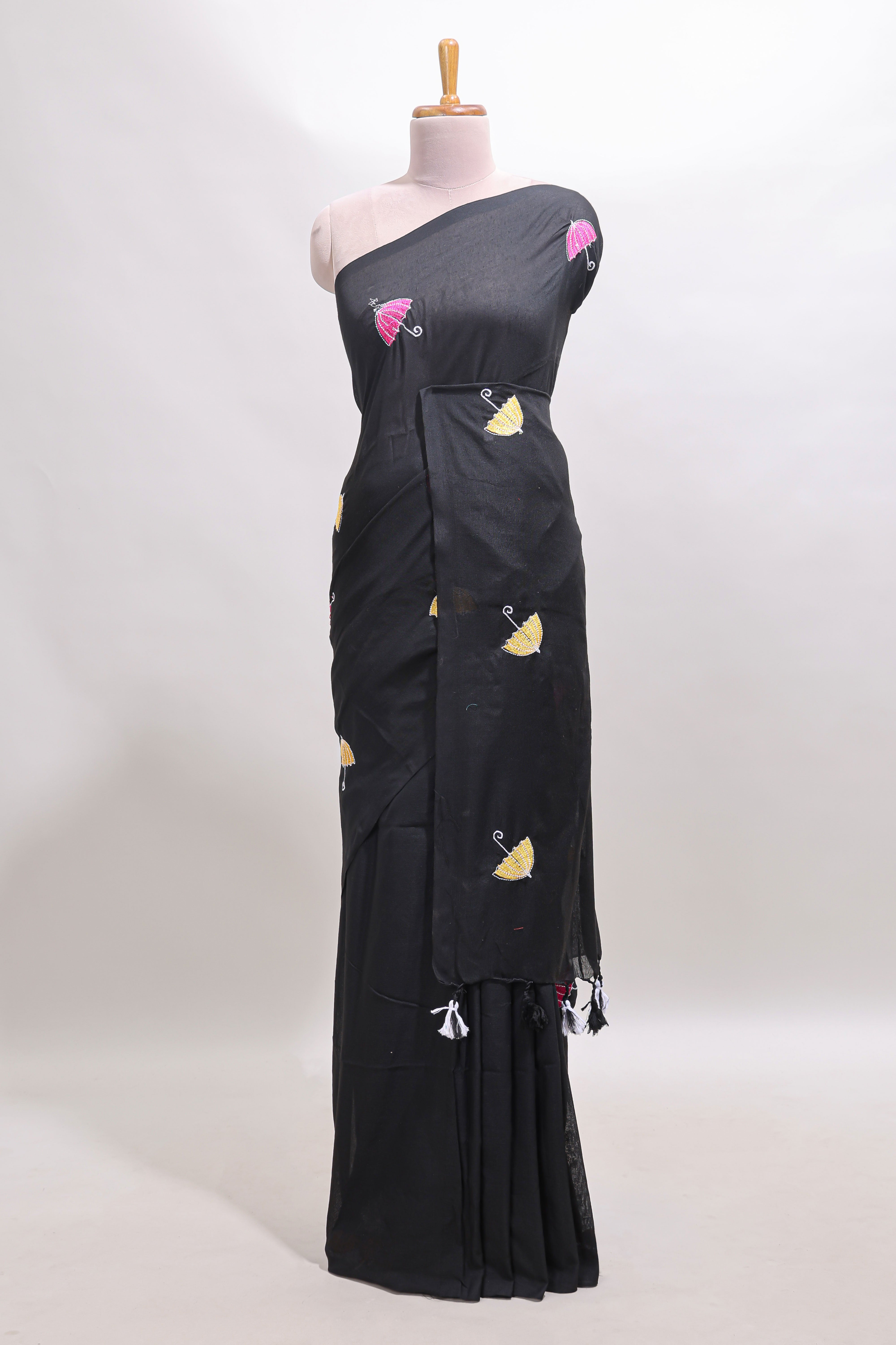 Borderless black umberla motifs design saree with contrast blouse and tassels