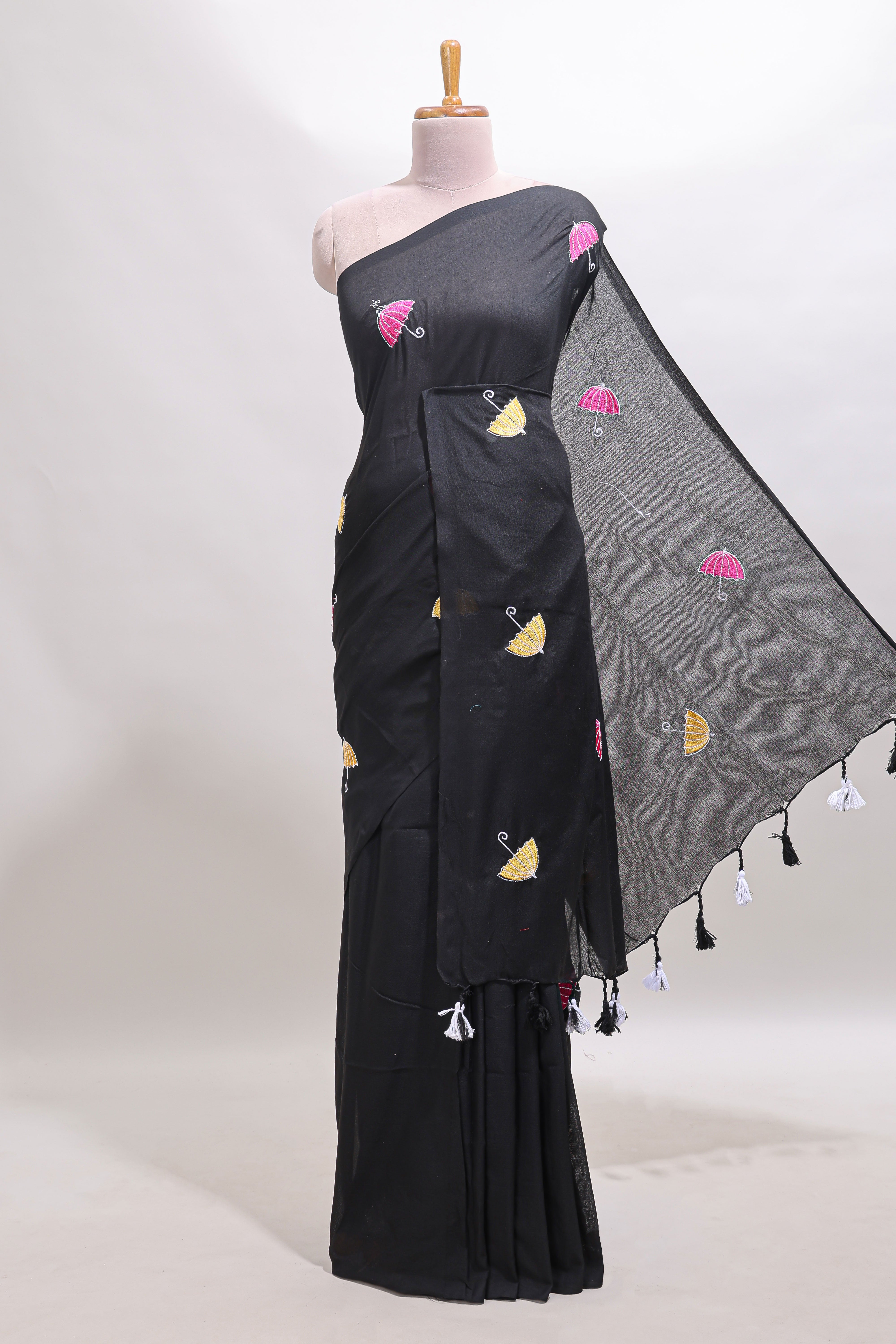 Borderless black umberla motifs design saree with contrast blouse and tassels