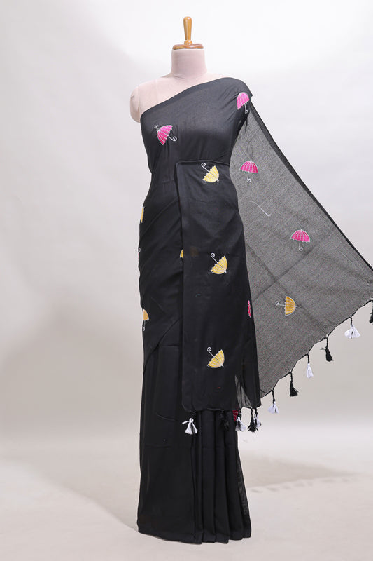 Borderless black umberla motifs design saree with contrast blouse and tassels