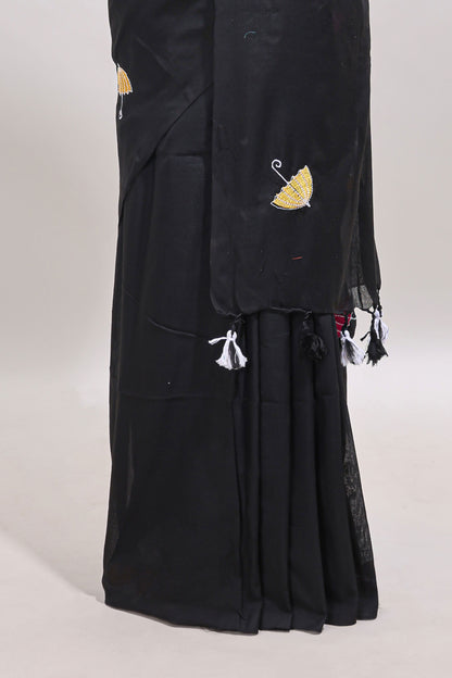 Borderless black umberla motifs design saree with contrast blouse and tassels