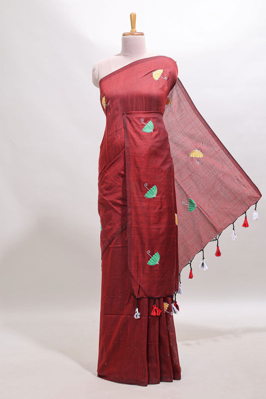 Borderless maroon umberla motifs design saree with contrast blouse and tassels