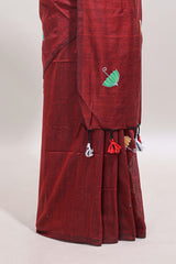 Borderless maroon umberla motifs design saree with contrast blouse and tassels