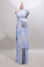 Light sky blue south cotton saree body with broad grey contrast borders and a matching striped pallu finished with tassels with a matching blouse piece