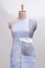 Light sky blue south cotton saree body with broad grey contrast borders and a matching striped pallu finished with tassels with a matching blouse piece