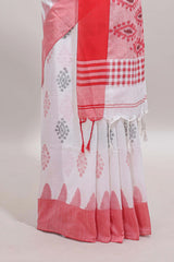 White ikkat style floral design south cotton saree with contrast border and blouse