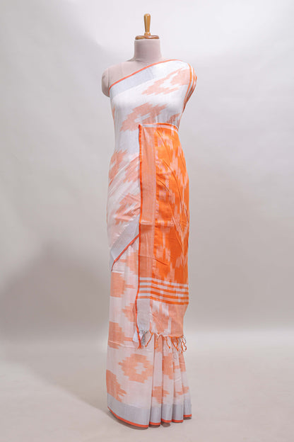 White ikkat style motifs south cotton saree with contrast silver zari border and blouse