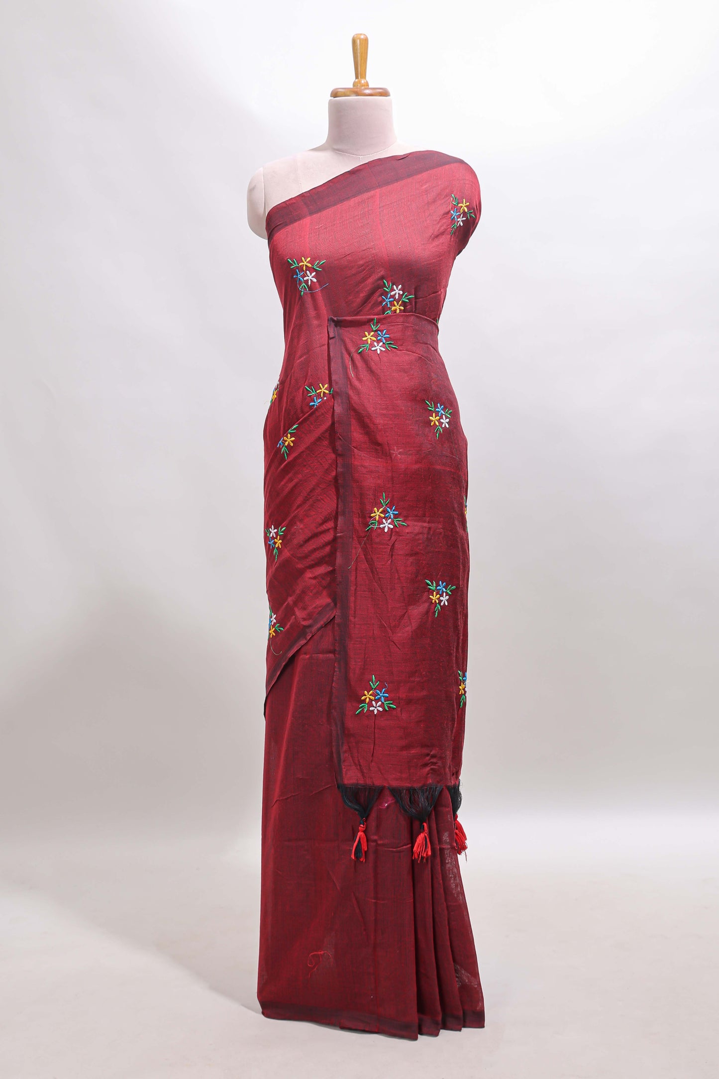 Maroon floral motifs south cotton sarees with self border and contrast printed blouse